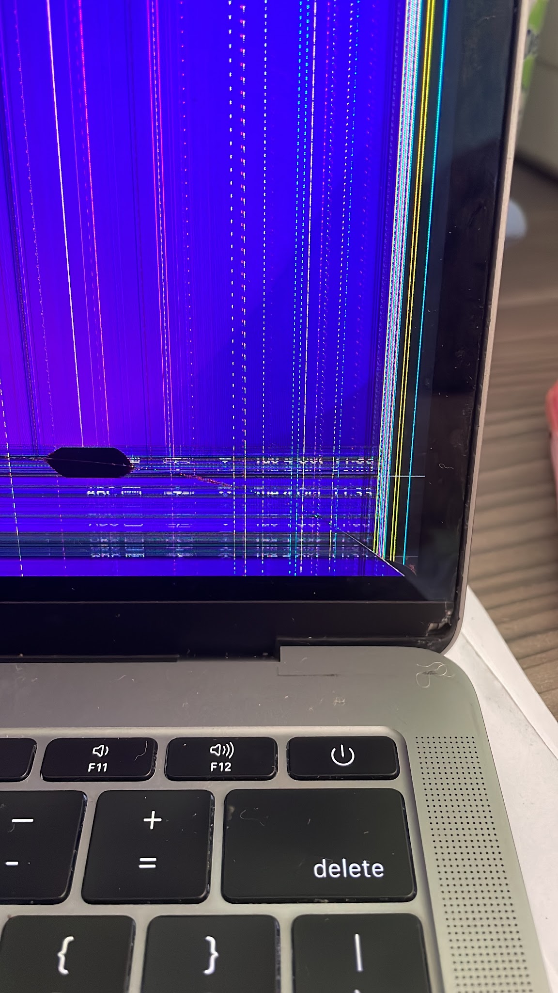 Cracked laptop screen before repair